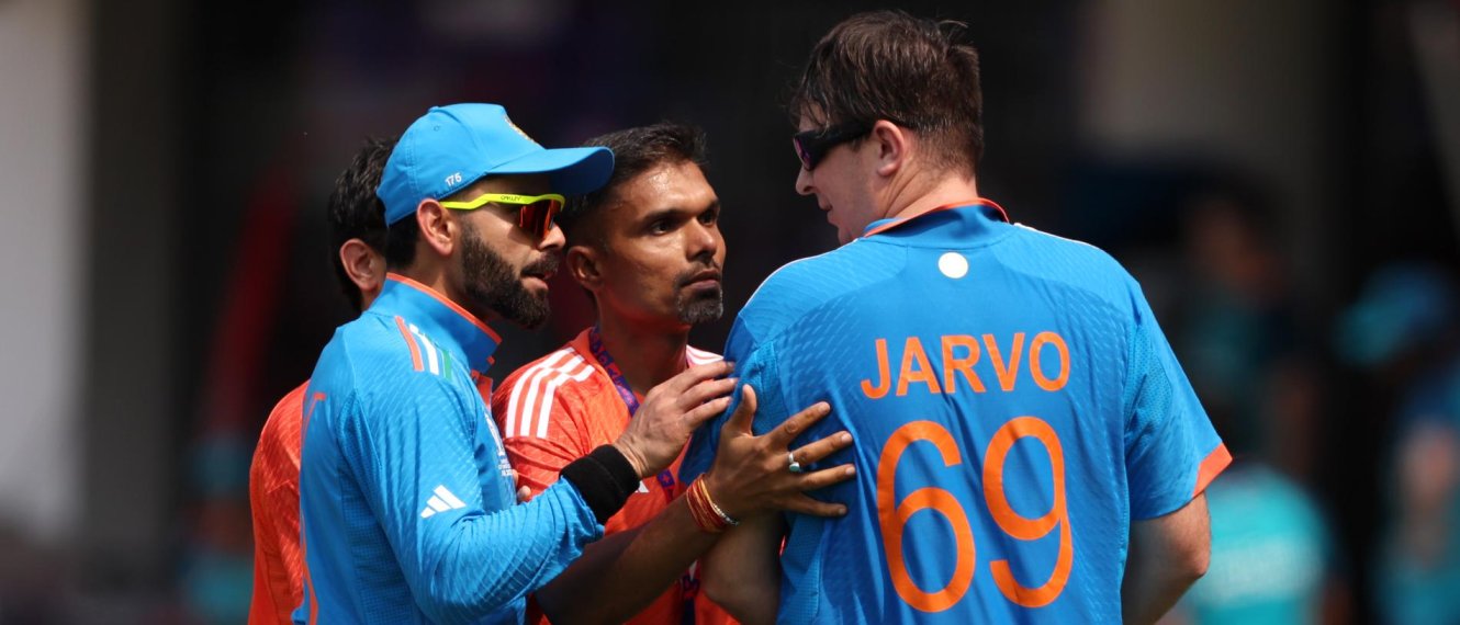 Who is jarvo: Jarvo 69, a known pitch invader, is led off the field by Virat Kohli.